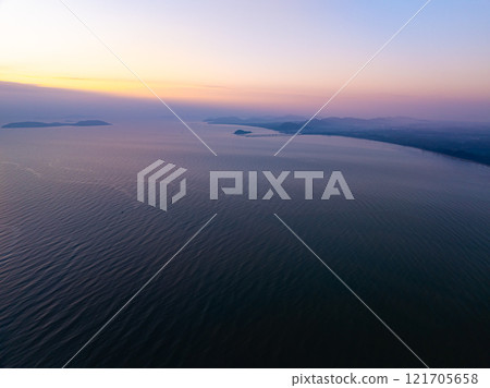 Aerial view sunset sky,Nature beautiful light sunset or sunrise over sea,Colorful scenery sunset sky,Amazing clouds and waves texture, sunrise sky background 121705658
