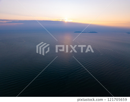 Aerial view sunset sky,Nature beautiful light sunset or sunrise over sea,Colorful scenery sunset sky,Amazing clouds and waves texture, sunrise sky background 121705659