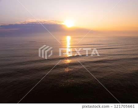 Aerial view sunset sky,Nature beautiful light sunset or sunrise over sea,Colorful scenery sunset sky,Amazing clouds and waves texture, sunrise sky background 121705661