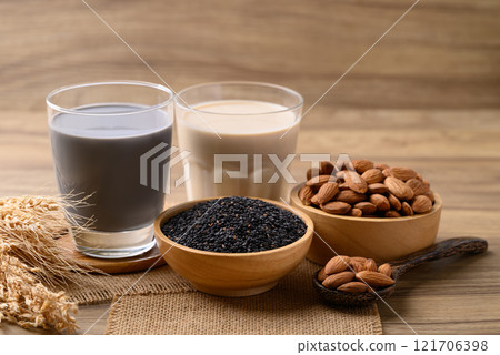 Alternative milk made from plant on wooden background, non dairy, Vegan food Alternative milk made from plant on wooden background, non dairy, Vegan food 121706398