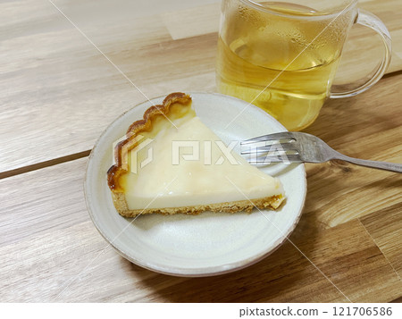 Table with cheese tart and tea 121706586