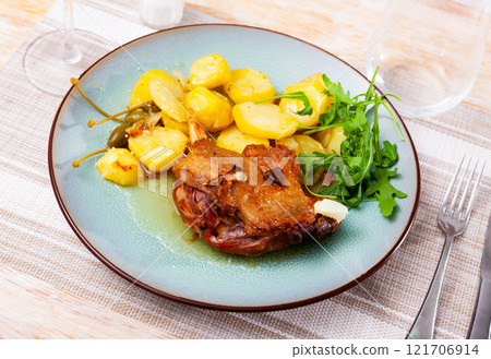 Portion of confit de canard served on plate Portion of confit de canard served on plate 121706914