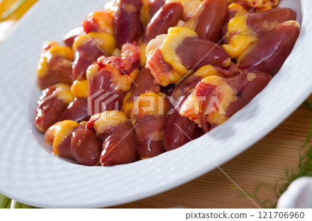 Top view of raw freshness chicken hearts before cooking at plate 121706960