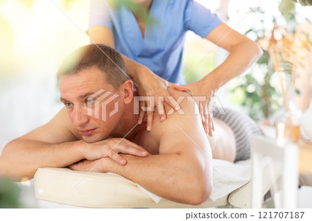 the client liescwhile the woman gives a massage the client liescwhile the woman gives a massage 121707187