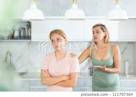 Angry mother yells at teenage girl sad daughter Angry mother yells at teenage girl sad daughter 121707364