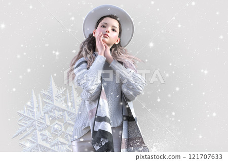 A young woman lost in thought in the falling snow 121707633