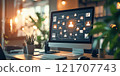 A desktop screen with digital networking user icons in an illuminated modern office setting highlights technology, connectivity, and remote collaboration. 121707743