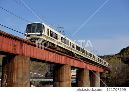 Six 221 series local trains running on the Yamatoji Line 121707899
