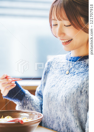 A young woman groans at the deliciousness A young woman groans at the deliciousness 121707918