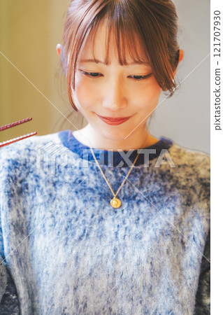 A young woman groans at the deliciousness 121707930