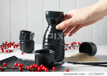 Japanese rice tincture, alcoholic drink, on the table. 121708973