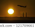 The first sunrise at Haneda Airport and a plane taking off, embarking on a new journey 121709661