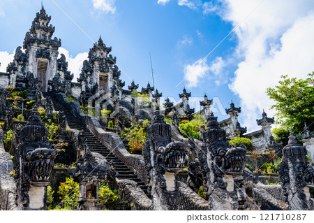 Bali, Indonesia - October 22, 2024: The ancient temple named "Pura Lempuyang Luhur". Bali, Indonesia - October 22, 2024: The ancient temple named "Pura Lempuyang Luhur". 121710287