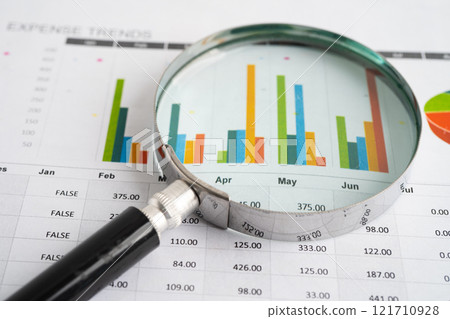 Magnifying glass on charts graphs paper. Financial development, Banking Account, Statistic, Investment Analytic research data economy. Magnifying glass on charts graphs paper. Financial development, Banking Account, Statistic, Investment Analytic research data economy. 121710928