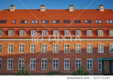 Traditional Scandinavian red brick building in sunny day Traditional Scandinavian red brick building in sunny day 121711267