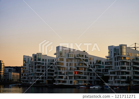 Modern residential building along waterfront on Copenhagen, Denmark Modern residential building along waterfront on Copenhagen, Denmark 121711271