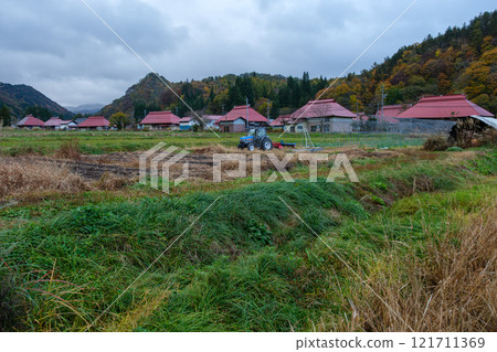 Row of houses in a mountain village 121711369