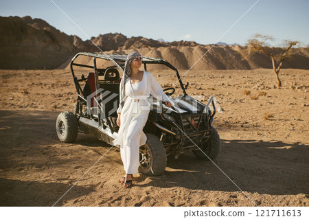 Woman tourist on quad bike ATV safari with desert background of Sharm El Sheikh Egypt 121711613