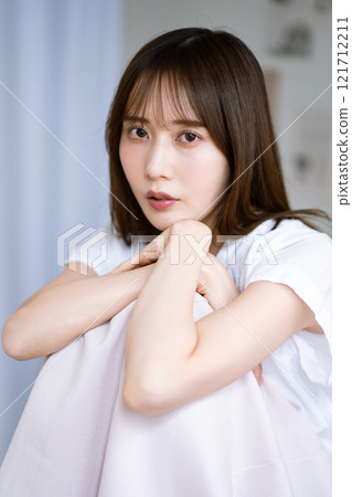 Young woman with long black hair 121712211