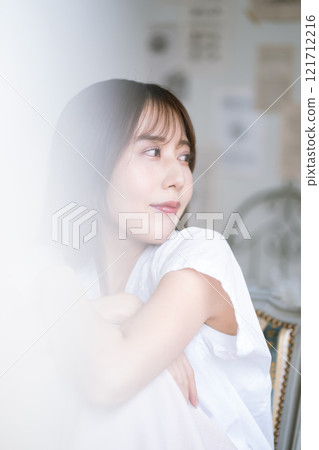 Young woman with long black hair 121712216