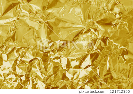 Gold foil leaf shiny texture, abstract yellow wrapping paper for background and design art work. Gold foil leaf shiny texture, abstract yellow wrapping paper for background and design art work. 121712590