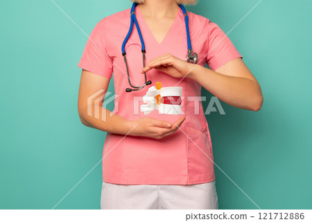 Orthopedist and surgeon with model or anatomical model of spine Orthopedist and surgeon with model or anatomical model of spine 121712886