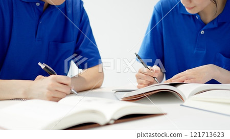 A caregiver studying for a qualification A caregiver studying for a qualification 121713623
