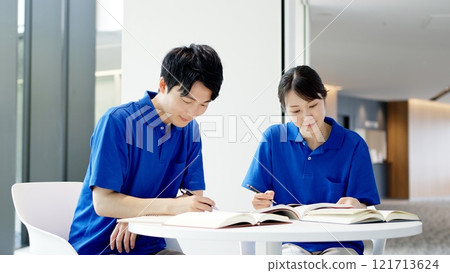 A caregiver studying for a qualification 121713624