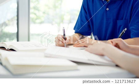 A caregiver studying for a qualification 121713627