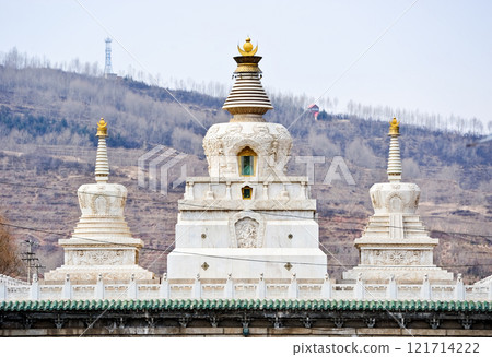 A white Buddhist stupa or pagoda in a Tibetan monastery, Tibet.  121714222