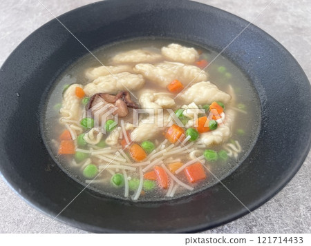 homemade ramen in black bowl 121714433