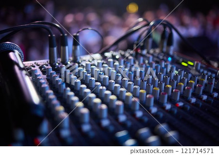 This is a professional audio mixing console that features colorful faders for enhanced usability This is a professional audio mixing console that features colorful faders for enhanced usability 121714571