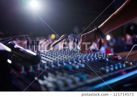 This is a professional audio mixing console that features colorful faders for enhanced usability This is a professional audio mixing console that features colorful faders for enhanced usability 121714573