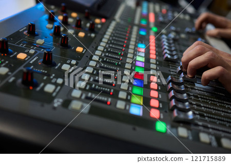 This is a professional audio mixing console that features colorful faders for enhanced usability 121715889