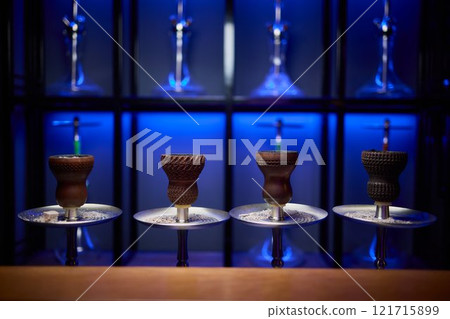 Person holding a hookah at a drinking establishment event Person holding a hookah at a drinking establishment event 121715899