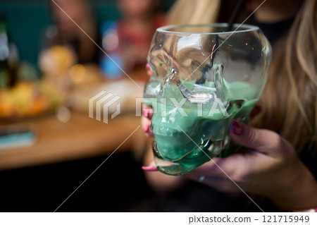 Enjoy a Colorful Cocktail Presented in a Unique and Eye Catching Skull Glass Style 121715949