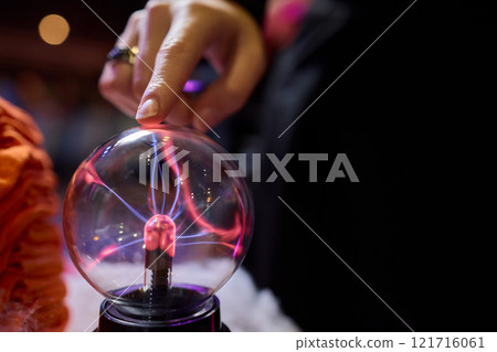 Captivating and mesmerizing interaction with a Plasma Globe awaits your exploration and fascination 121716061