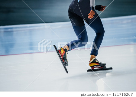 legs female speed skater in dark blue skin suit and skates legs female speed skater in dark blue skin suit and skates 121716267