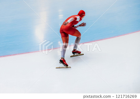 male athlete running turn in speed skating competition 121716269