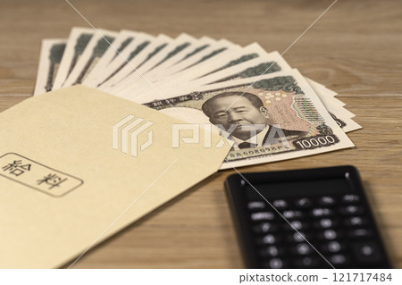 Counting money at home on payday Counting money at home on payday 121717484