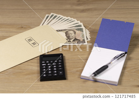 Counting money at home on payday Counting money at home on payday 121717485