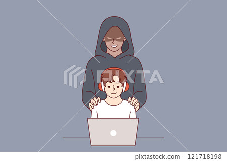 Cybercriminal stands behind little boy using laptop, for concept of danger of pedophilia on internet Cybercriminal stands behind little boy using laptop, for concept of danger of pedophilia on internet 121718198
