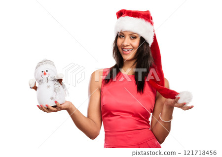 Mixed race woman in santa hat with little snowman. Mixed race woman in santa hat with little snowman. 121718456