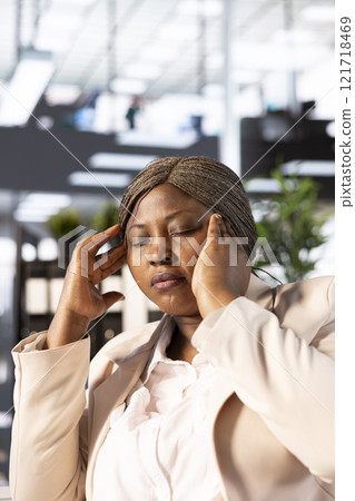 Stressed manager suffering headache, feeling depressed after evaluating disastrous company performance. CEO having painful facial expression while seeing terrible financial data metrics Stressed manager suffering headache, feeling depressed after evaluating disastrous company performance. CEO having painful facial expression while seeing terrible financial data metrics 121718469