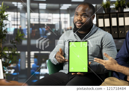Startup CEO attends meeting to talk about new business vision with executive board member, using chroma key tablet. African american man using mockup device to pitch investment strategy to manager Startup CEO attends meeting to talk about new business vision with executive board member, using chroma key tablet. African american man using mockup device to pitch investment strategy to manager 121718484