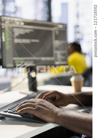 Programmer typing on keyboard, developing machine learning APIs solving complex problems. Close up of man writing code, training predictive models capable of handling complex tasks Programmer typing on keyboard, developing machine learning APIs solving complex problems. Close up of man writing code, training predictive models capable of handling complex tasks 121718502