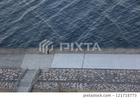 Seaside landscape, winter, a person lost in thought 121718773