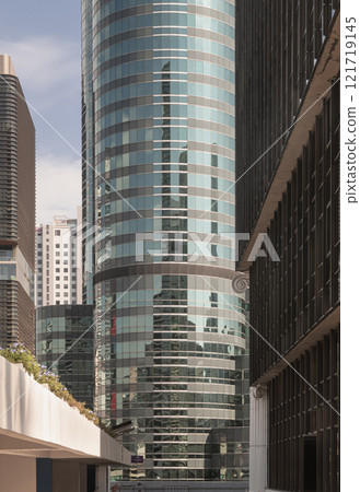 Perspective view of modern building with blue sky reflection in windows glass. Perspective view of modern building with blue sky reflection in windows glass. 121719145