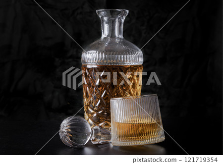 Design elements of The crystal decanter of whiskey, Glass Lid with Whiskey glass on dark background with reflection. 121719354