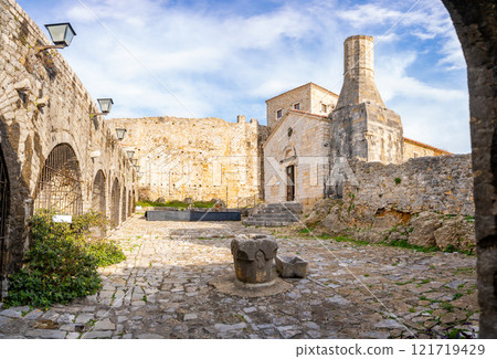 Street view of the Archaeological Museum or Local History Museum in Ulcinj Old Town or Stari Grad in Ulcinj, Montenegro. Street view of the Archaeological Museum or Local History Museum in Ulcinj Old Town or Stari Grad in Ulcinj, Montenegro. 121719429
